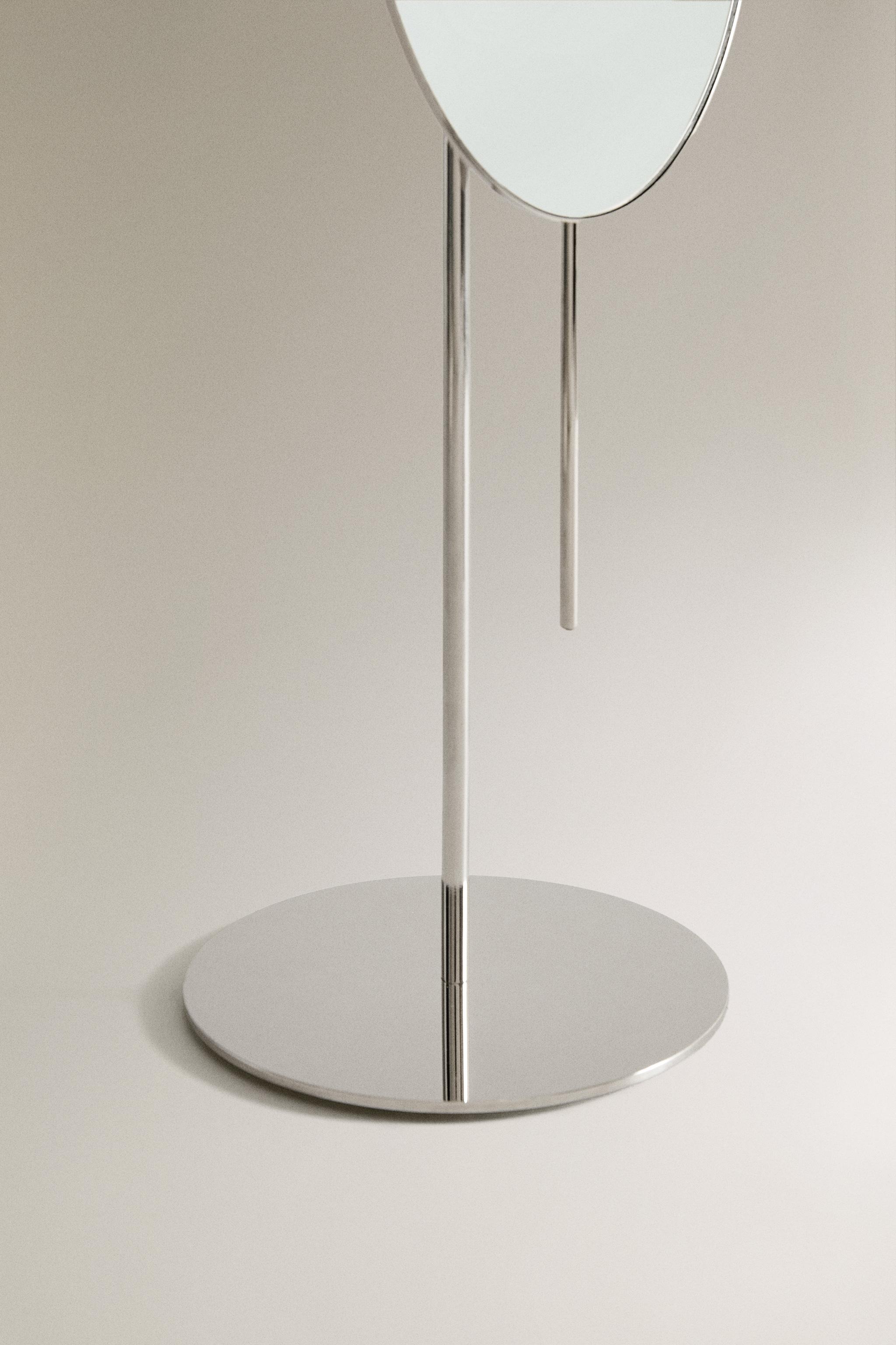 MAGNIFYING METAL MIRROR